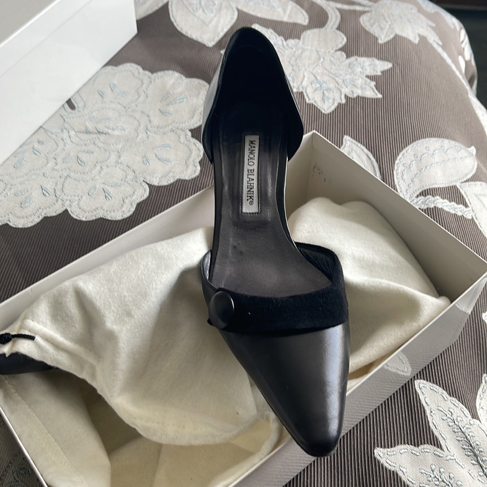 Black leather Manolo Blahnik kitten heel.